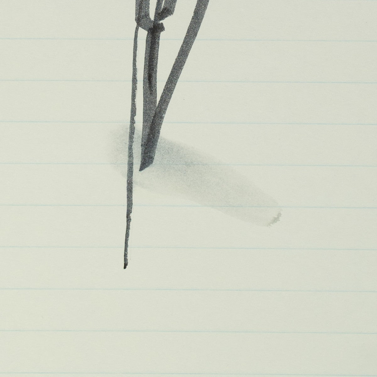Detail of “Wrap Artist”: a smudge of graphite near the figure’s feet