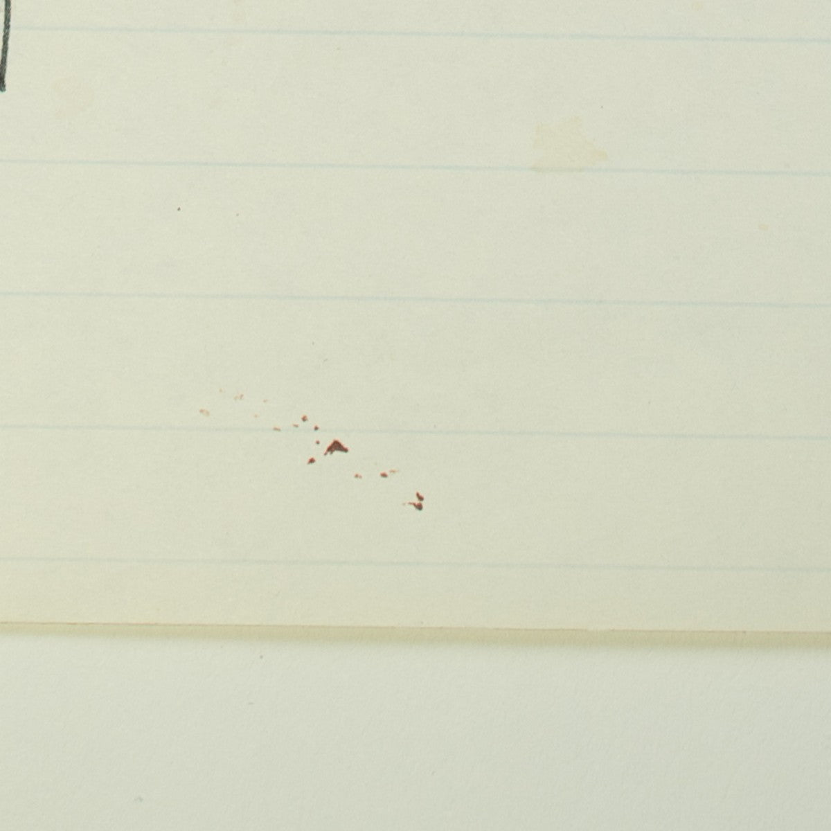 Detail of “Long Story Short”: small red specks near the foot of the sheet